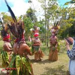 Hagen Women in Traditional Attire Dancing with Tourist Hagen Women in Traditional Attire Dancing with Tourist