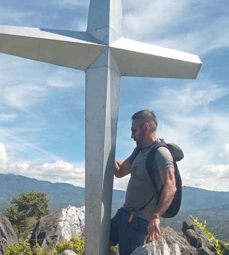 Tourist on a Mountain with Cross Cropped2 Tourist on a Mountain with Cross Cropped2