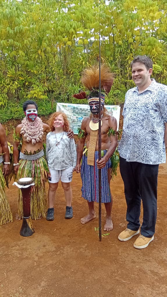 Tourists with traditional locals